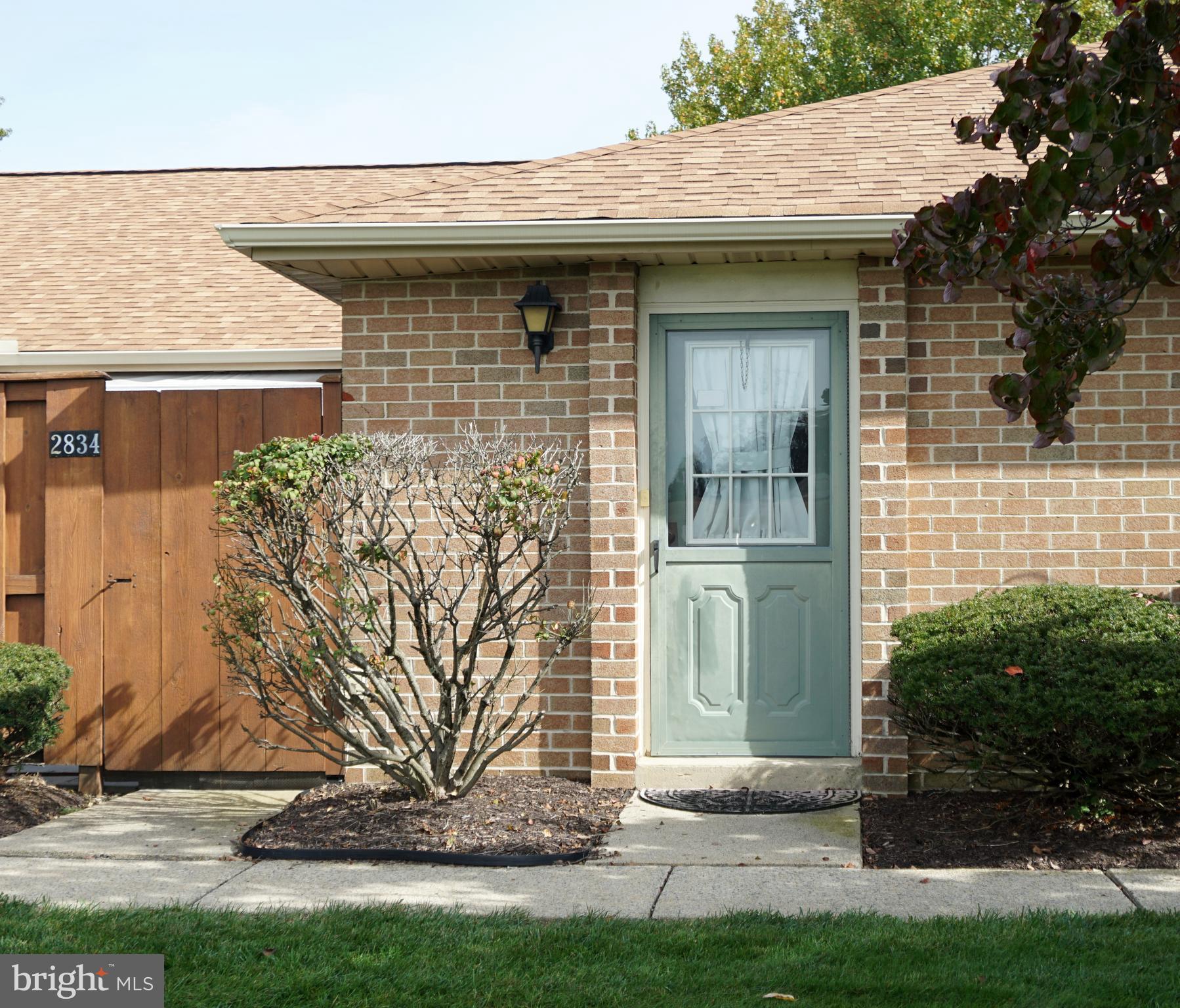 a view of a wooden door of the house