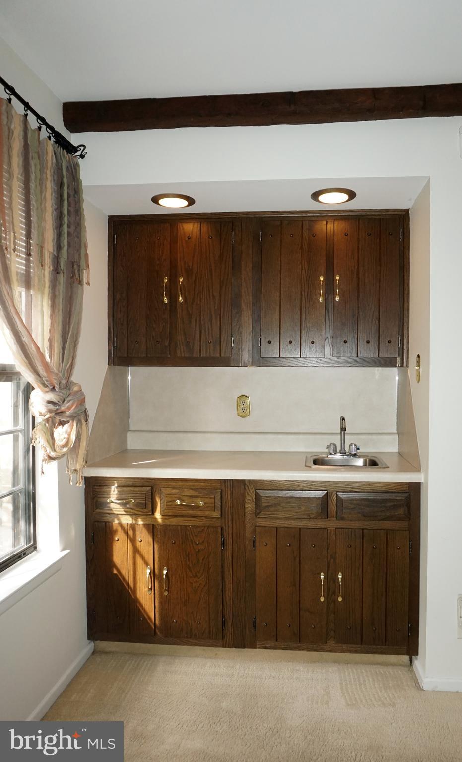 2834 Springhaven Place Macungie, PA 18062 - Photo 9 of 19 a sink with a stove and cabinets