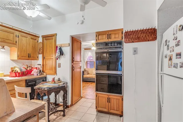 a kitchen with stainless steel appliances a refrigerator and a stove top oven