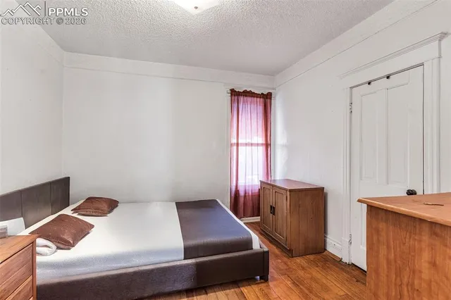 a room with a bed and a window