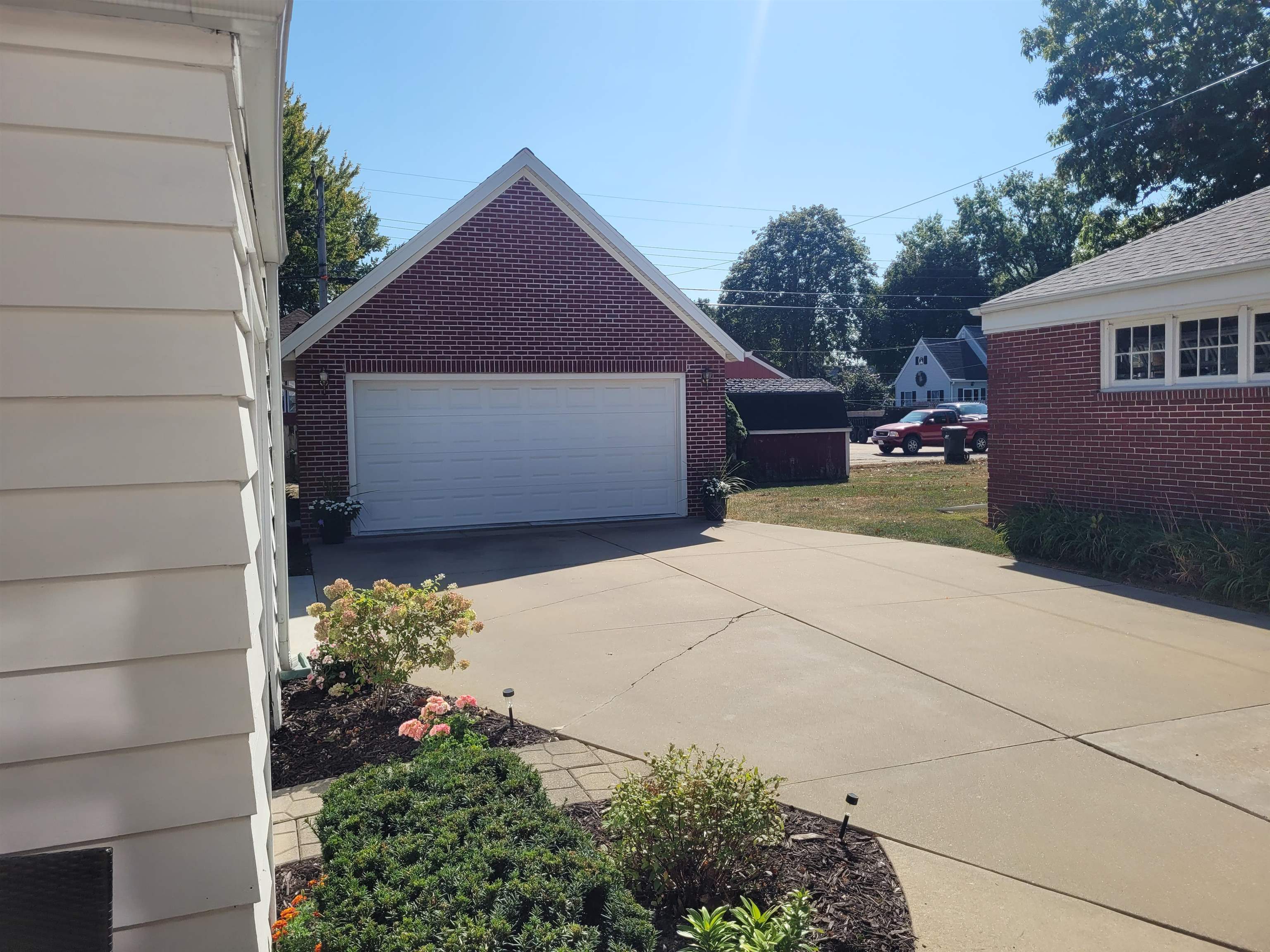 509 West 14th Street Sterling, IL 61081 - Photo 16 of 70 a front view of a house with a yard and garage