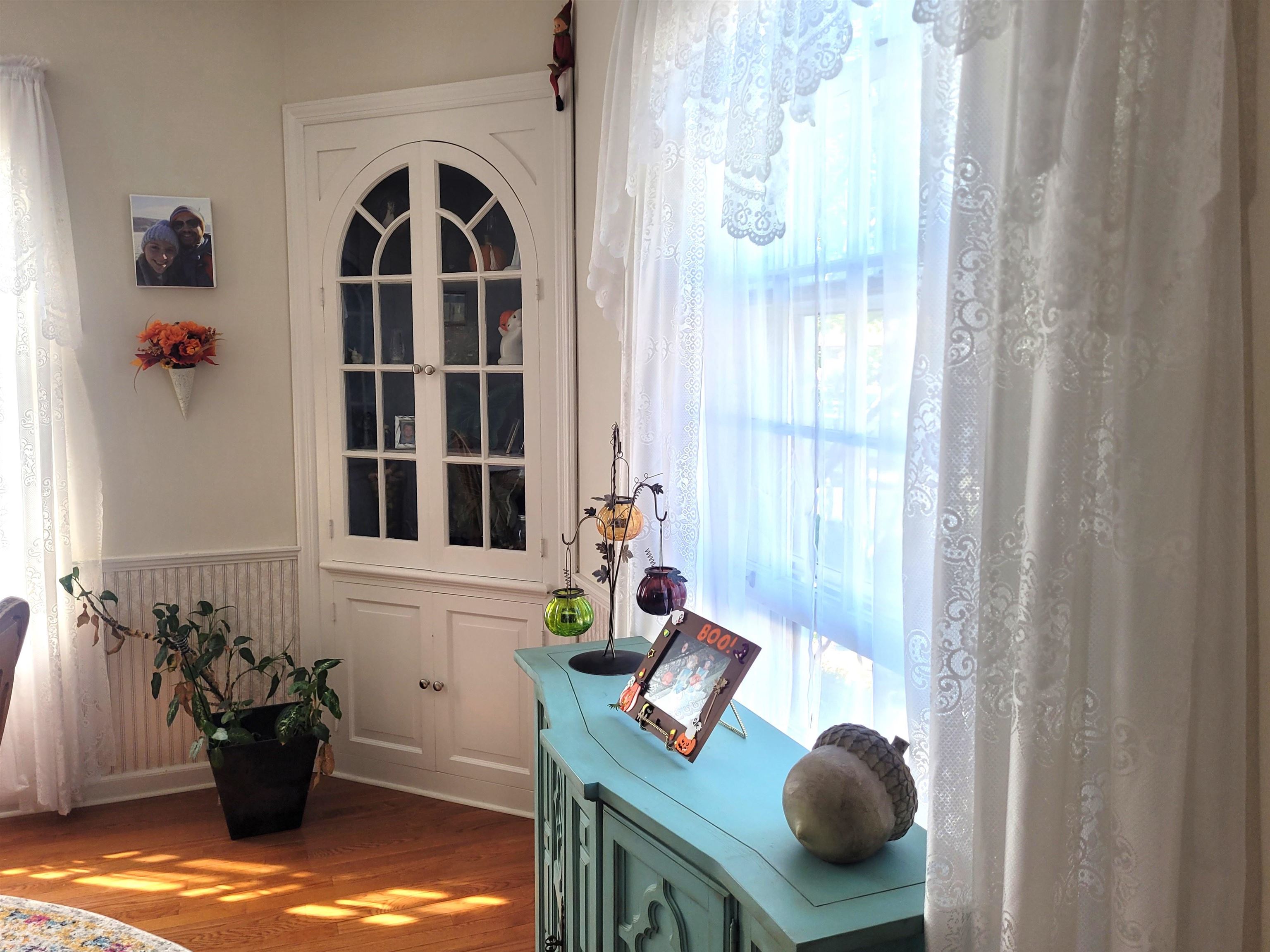 509 West 14th Street Sterling, IL 61081 - Photo 25 of 70 a living room with furniture and a window