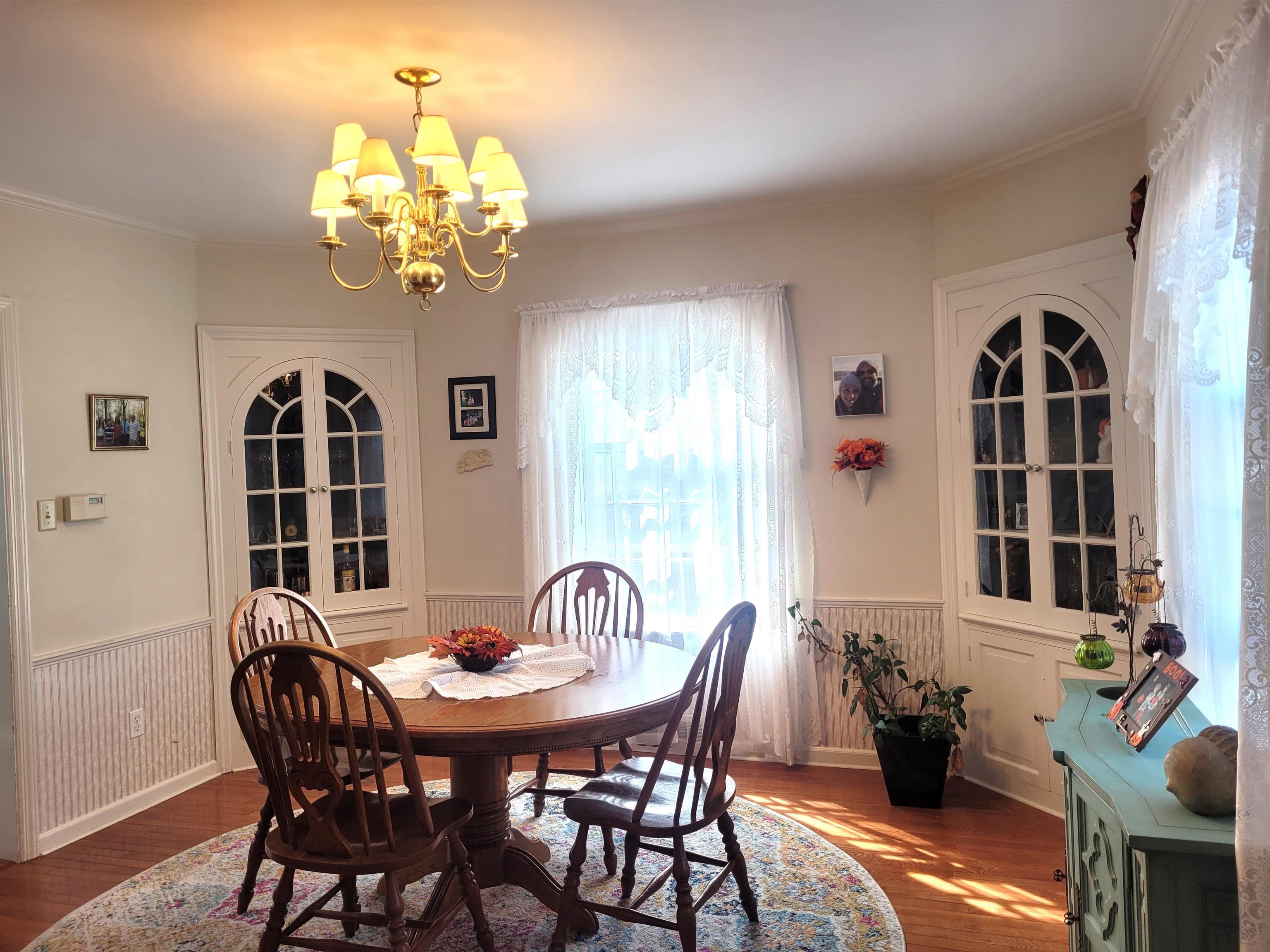 509 West 14th Street Sterling, IL 61081 - Photo 27 of 70 a view of a dining room with furniture and chandelier
