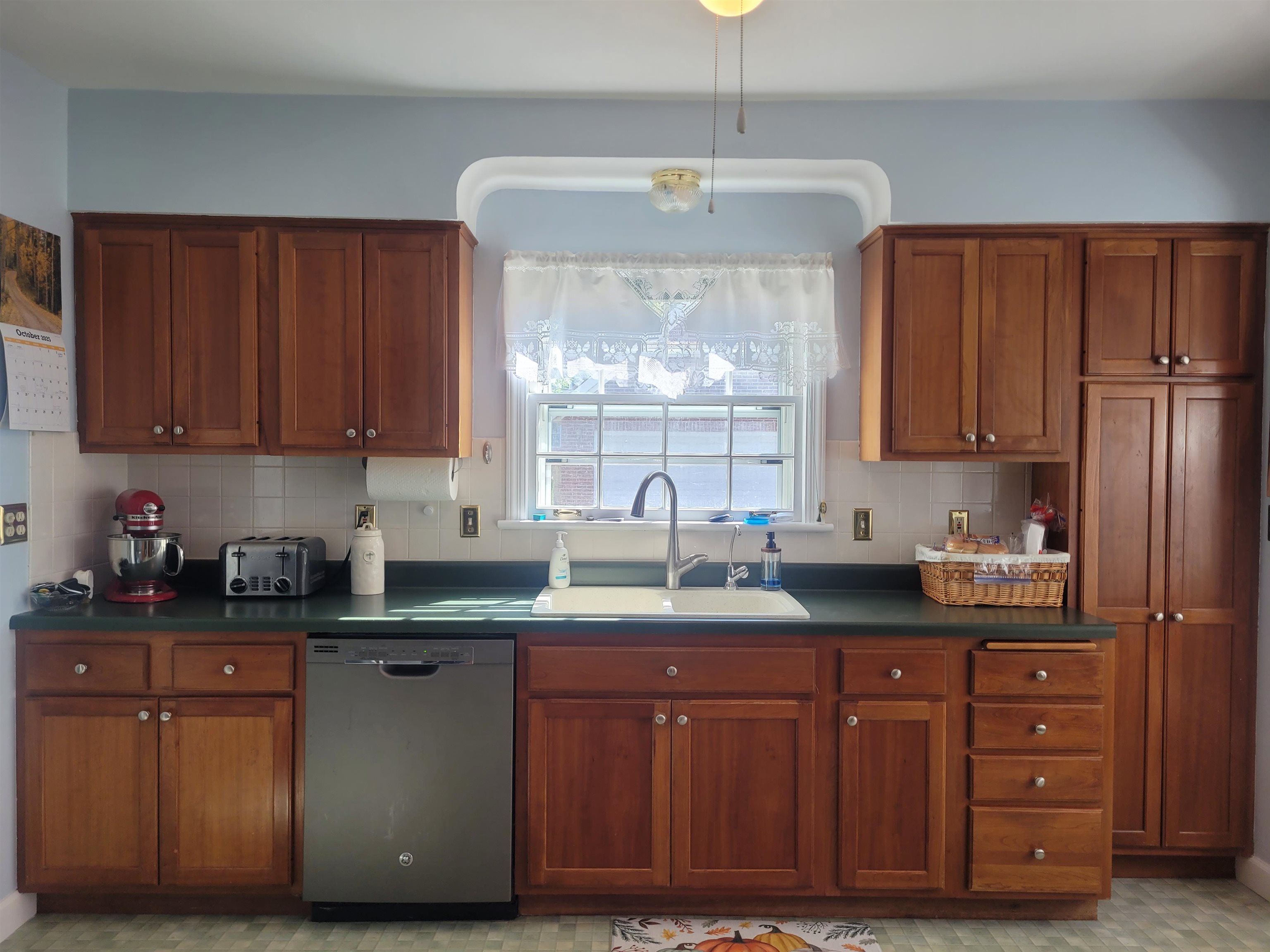 509 West 14th Street Sterling, IL 61081 - Photo 30 of 70 a kitchen with granite countertop a sink cabinets and window
