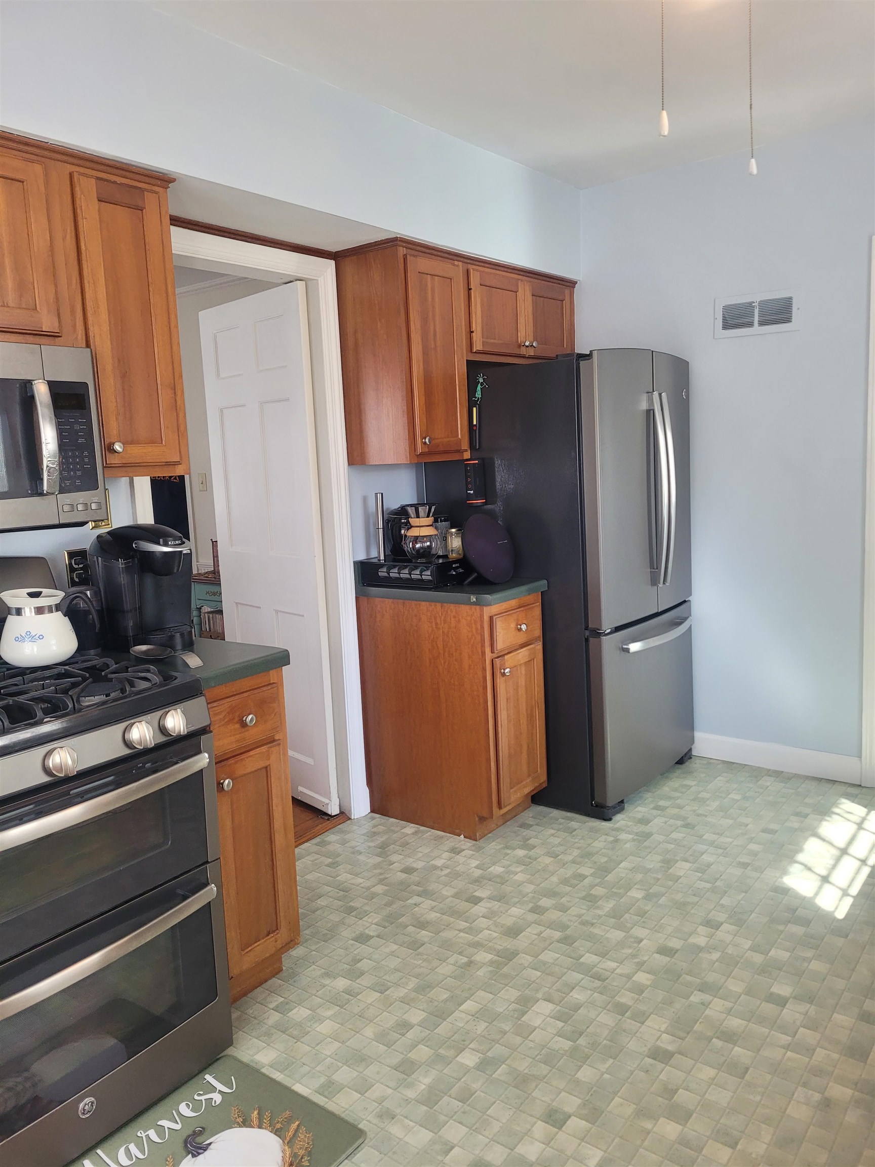 509 West 14th Street Sterling, IL 61081 - Photo 33 of 70 a kitchen with stainless steel appliances granite countertop a refrigerator stove and a sink