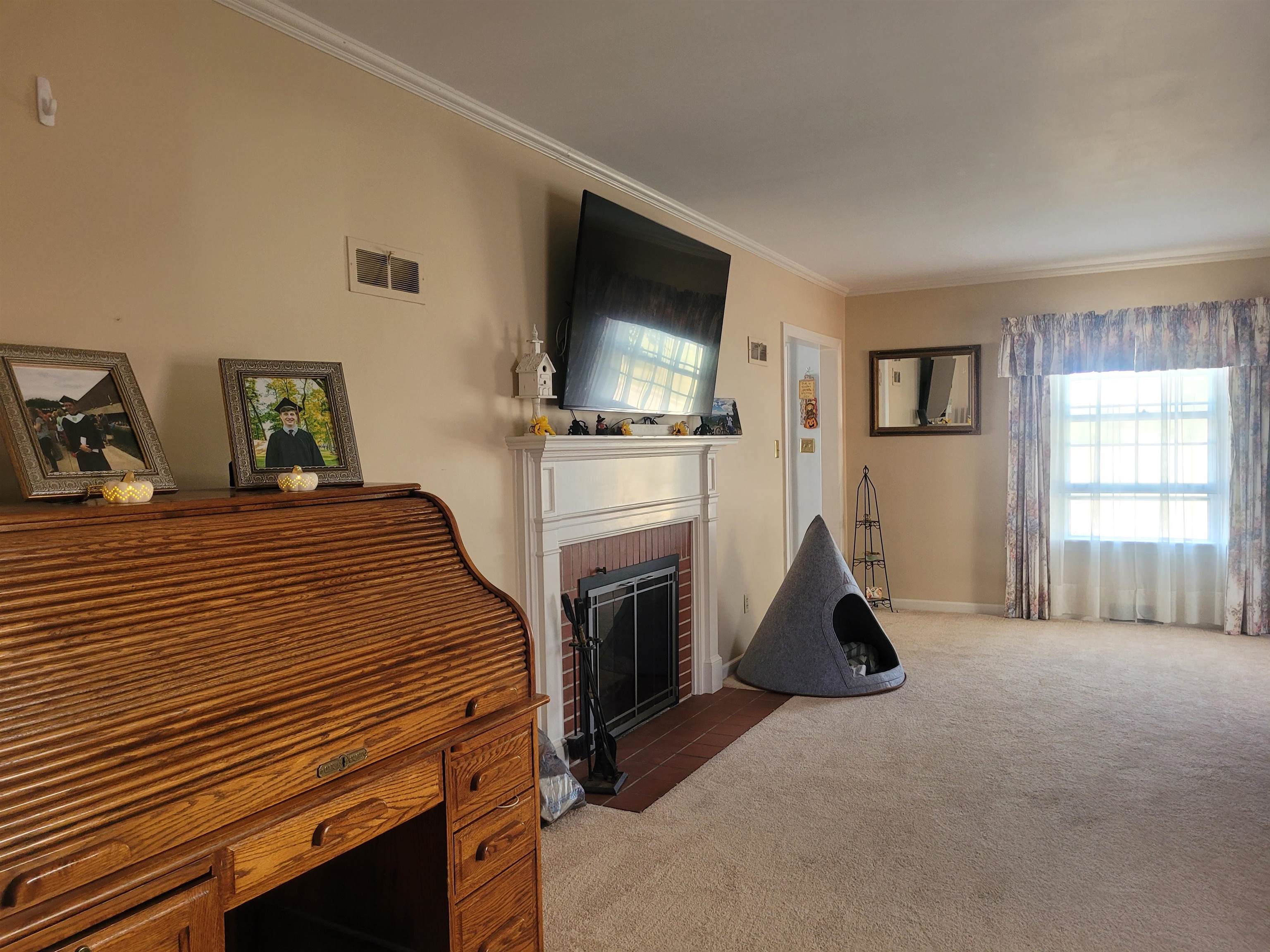 509 West 14th Street Sterling, IL 61081 - Photo 39 of 70 a bedroom with a bed a flat screen tv and dresser