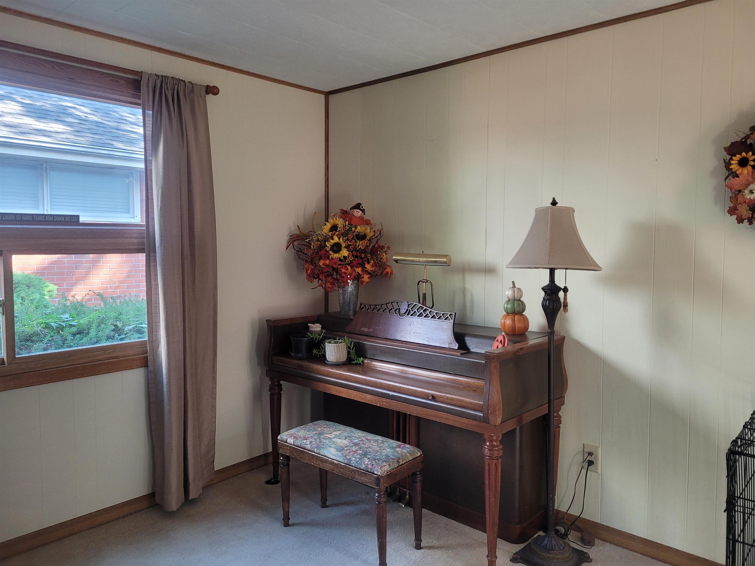 509 West 14th Street Sterling, IL 61081 - Photo 41 of 70 a room with furniture and a window