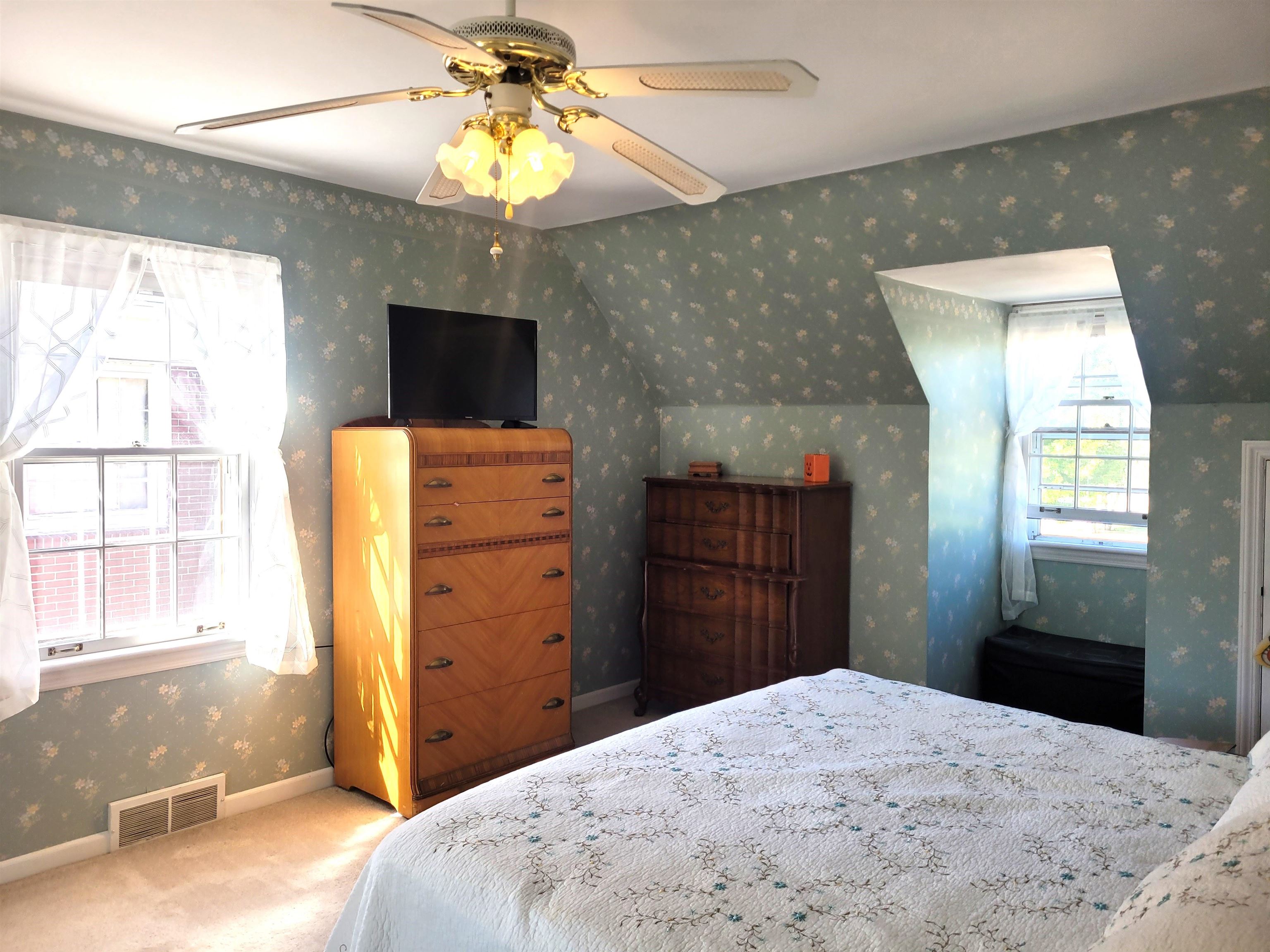 509 West 14th Street Sterling, IL 61081 - Photo 56 of 70 a bedroom with a bed and a dresser