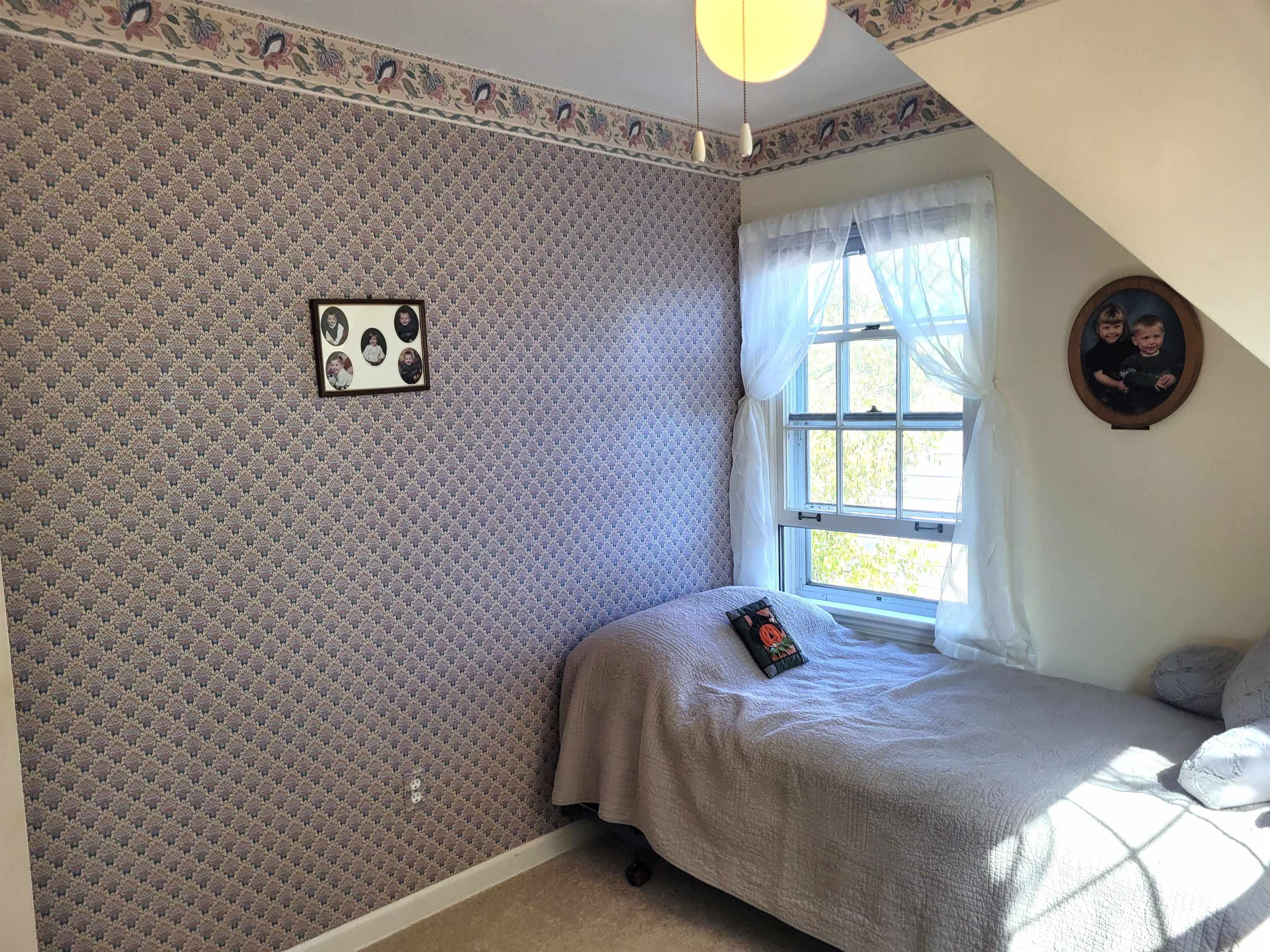 509 West 14th Street Sterling, IL 61081 - Photo 63 of 70 a bedroom with a bed and a window