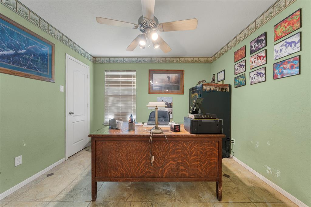 10829 China Spring Road Waco, TX 76708 - Photo 13 of 27 a room with stainless steel appliances kitchen island granite countertop furniture a rug and a window
