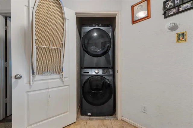 a view of a hallway with washer and dryer