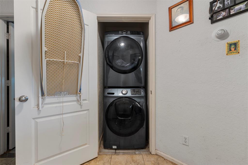 10829 China Spring Road Waco, TX 76708 - Photo 14 of 27 a view of a hallway with washer and dryer