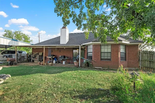 a view of a house with a yard porch and sitting area