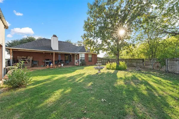a view of a house with a yard porch and sitting area