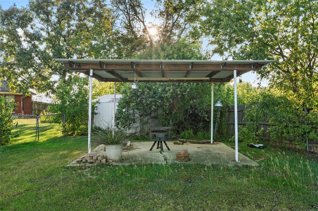 10829 China Spring Road Waco, TX 76708 - Photo 19 of 27 a view of a chair and table in the garden