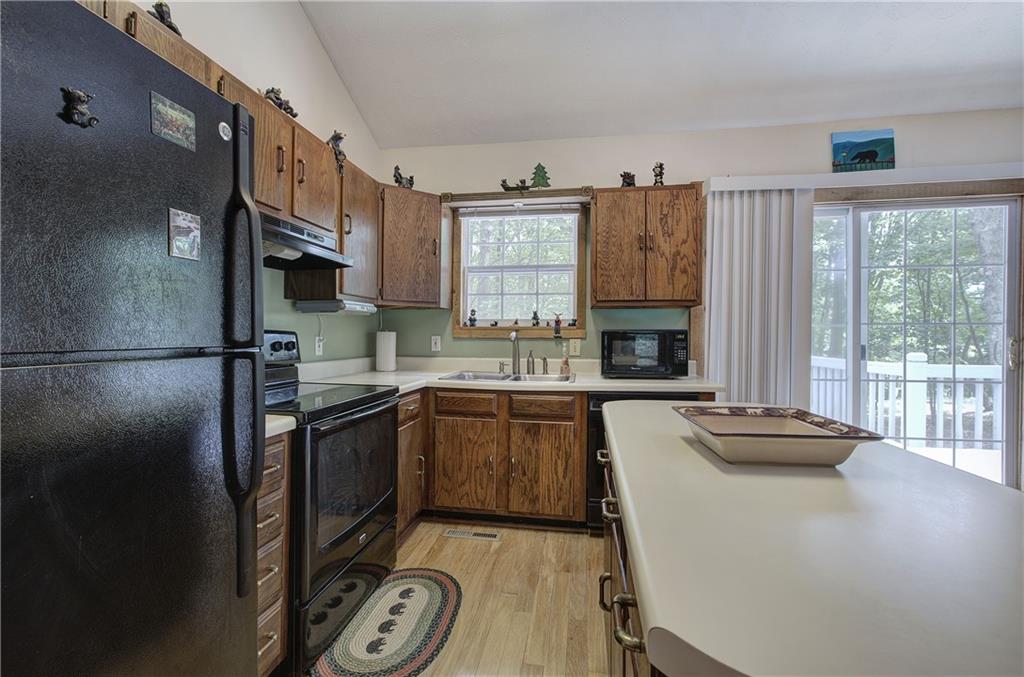 214 South View Trail Jasper, GA 30143 - Photo 15 of 72 a kitchen with stainless steel appliances granite countertop a sink stove and refrigerator
