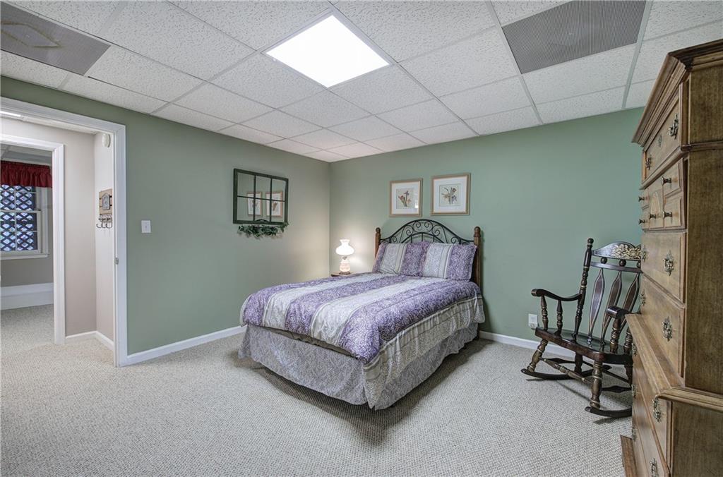 214 South View Trail Jasper, GA 30143 - Photo 40 of 72 a spacious bedroom with a bed and a table