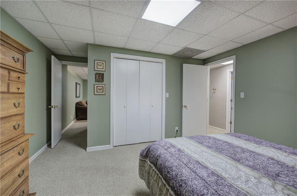 214 South View Trail Jasper, GA 30143 - Photo 42 of 72 a bedroom with a bed and a walk in closet