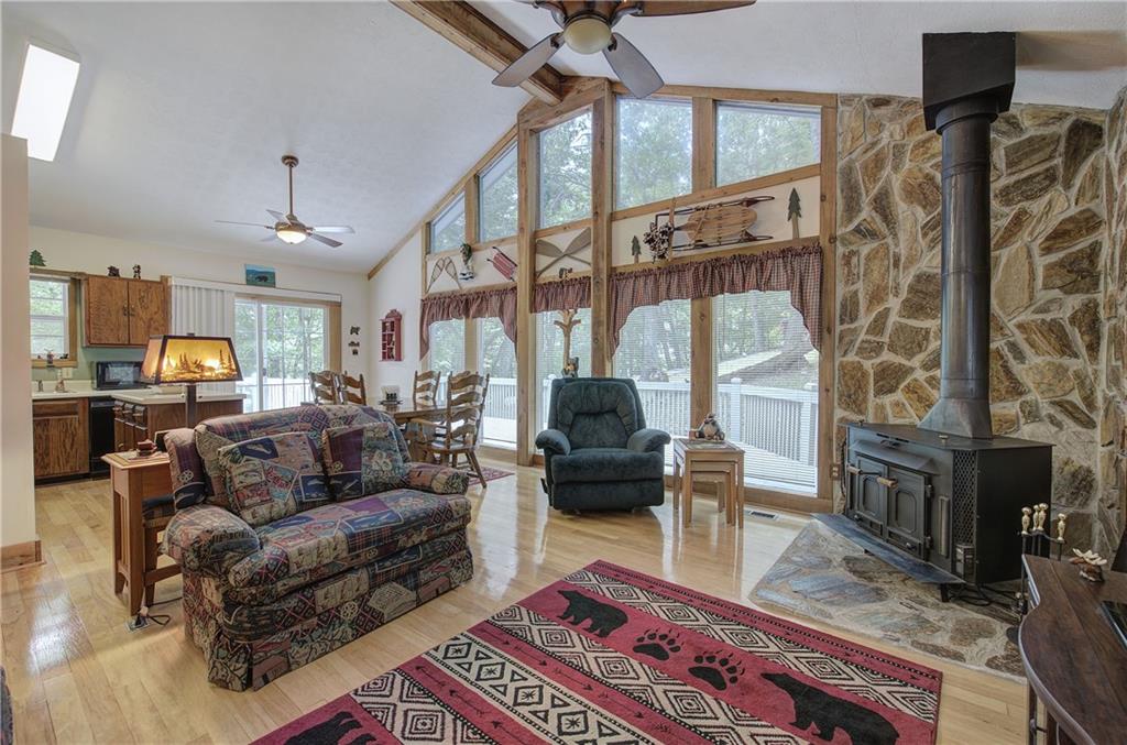 214 South View Trail Jasper, GA 30143 - Photo 5 of 72 a living room with furniture a fireplace and a chandelier