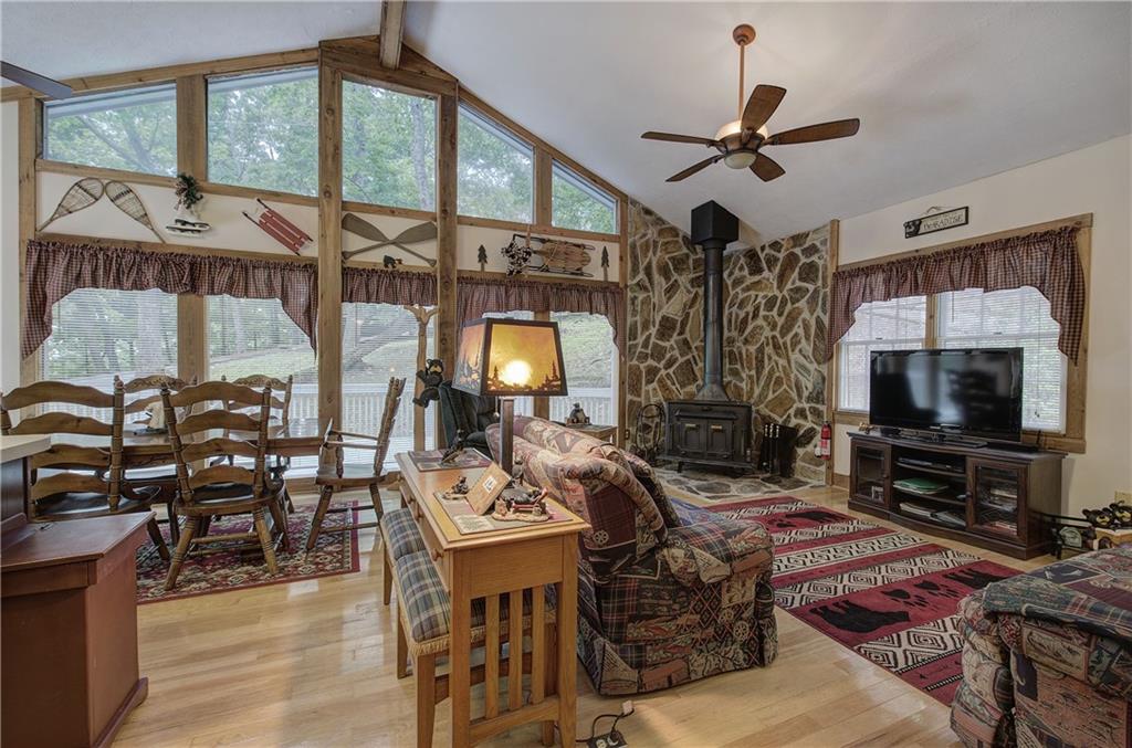 214 South View Trail Jasper, GA 30143 - Photo 6 of 72 a living room with furniture a flat screen tv and a window