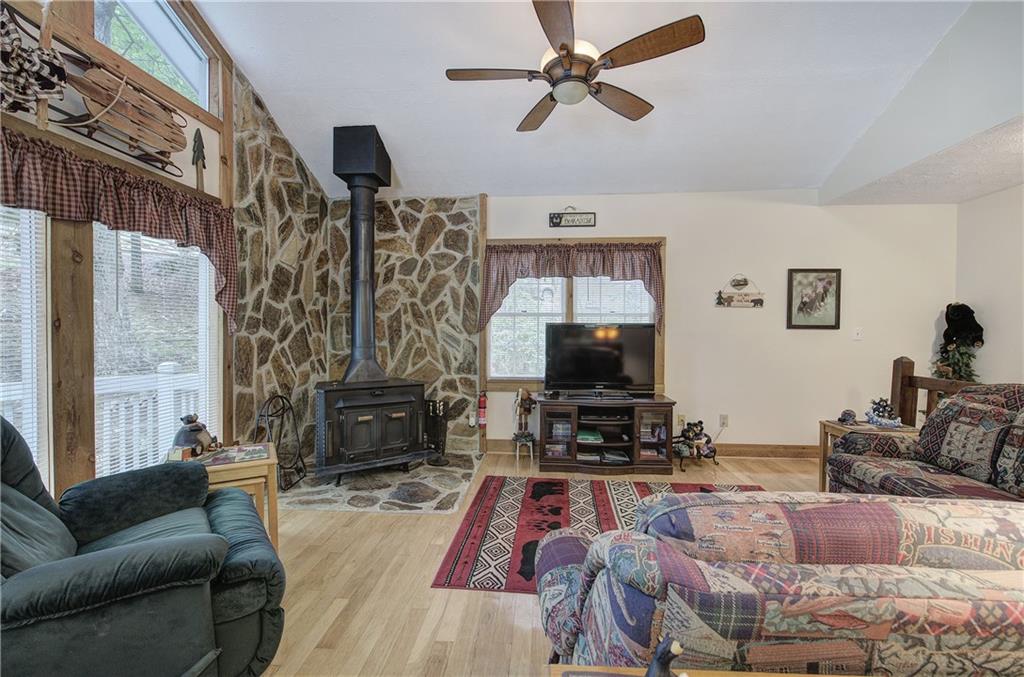 214 South View Trail Jasper, GA 30143 - Photo 7 of 72 a living room with furniture a fireplace and a flat screen tv