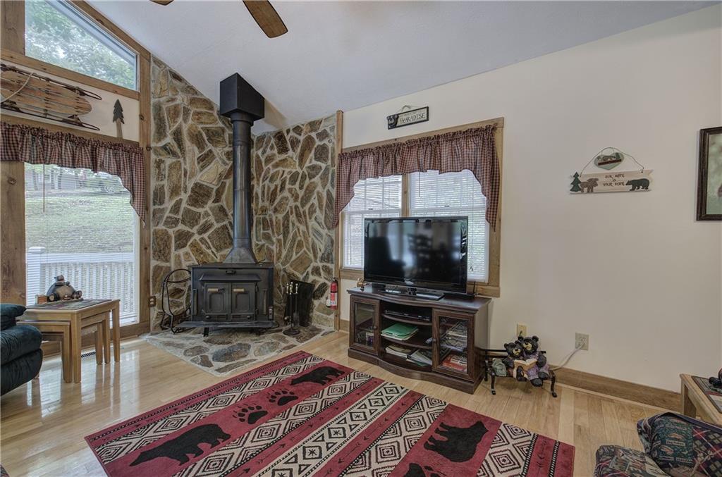 214 South View Trail Jasper, GA 30143 - Photo 8 of 72 a living room with furniture a flat screen tv and a fireplace
