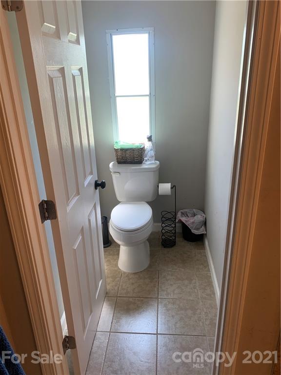 7815 Stokes Ferry Road Salisbury, NC 28146 - Photo 9 of 14 a bathroom with a sink and a toilet