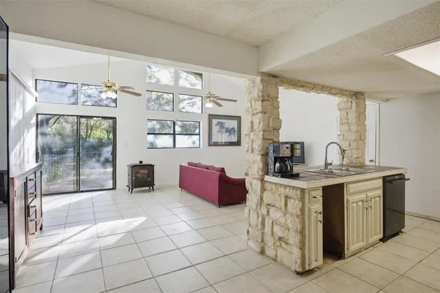 a spacious bathroom with a tub sink and mirror