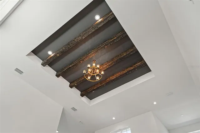 a living room with stainless steel appliances kitchen island furniture and a kitchen view