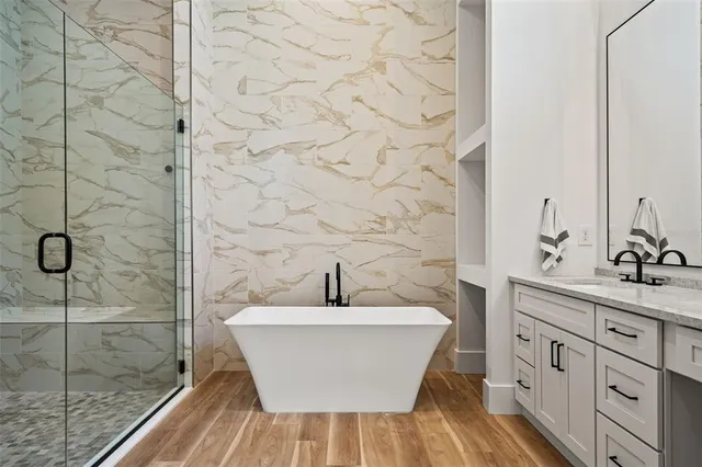 a bedroom with a bed a window and closet