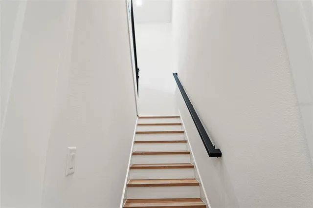 a view of a livingroom with a ceiling fan and window