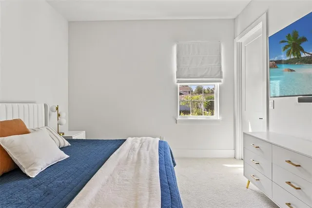 a kitchen with stainless steel appliances kitchen island granite countertop a table and chairs