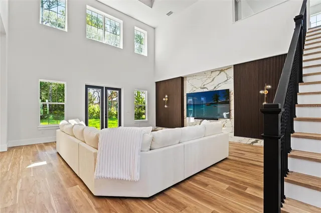 a living room with furniture white walls and white walls
