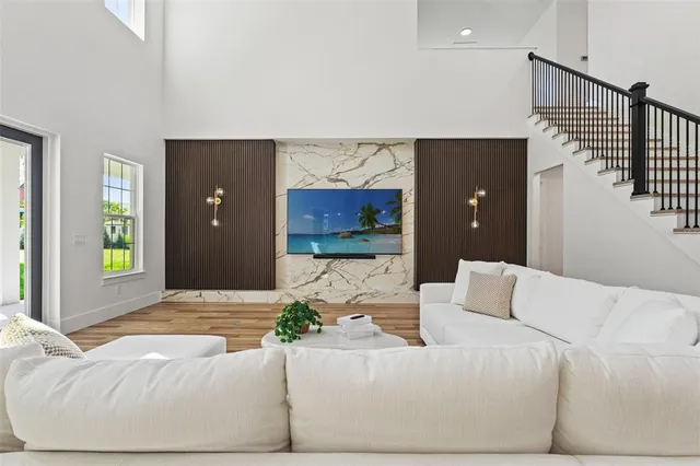 a living room with furniture and a large window