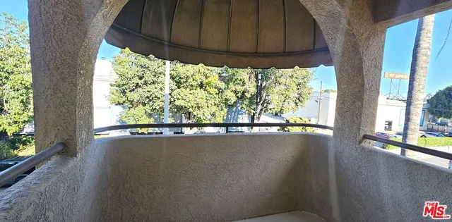 a view of a room that has a window in it