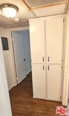 a view of an empty room and a window