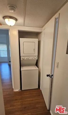 a view of an empty room and wooden floor