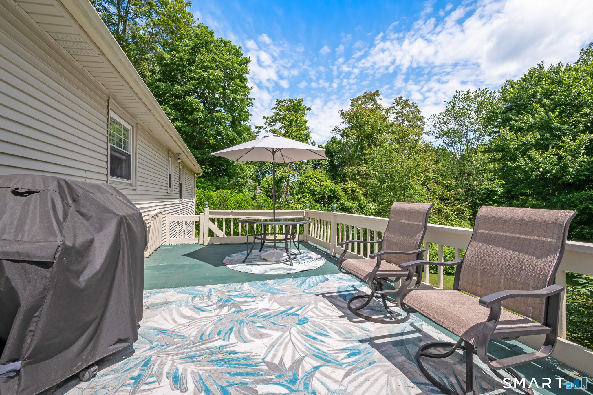 1611 Shepard Avenue Hamden, CT 06518 - Photo 25 of 31 a view of a chair and table on the deck