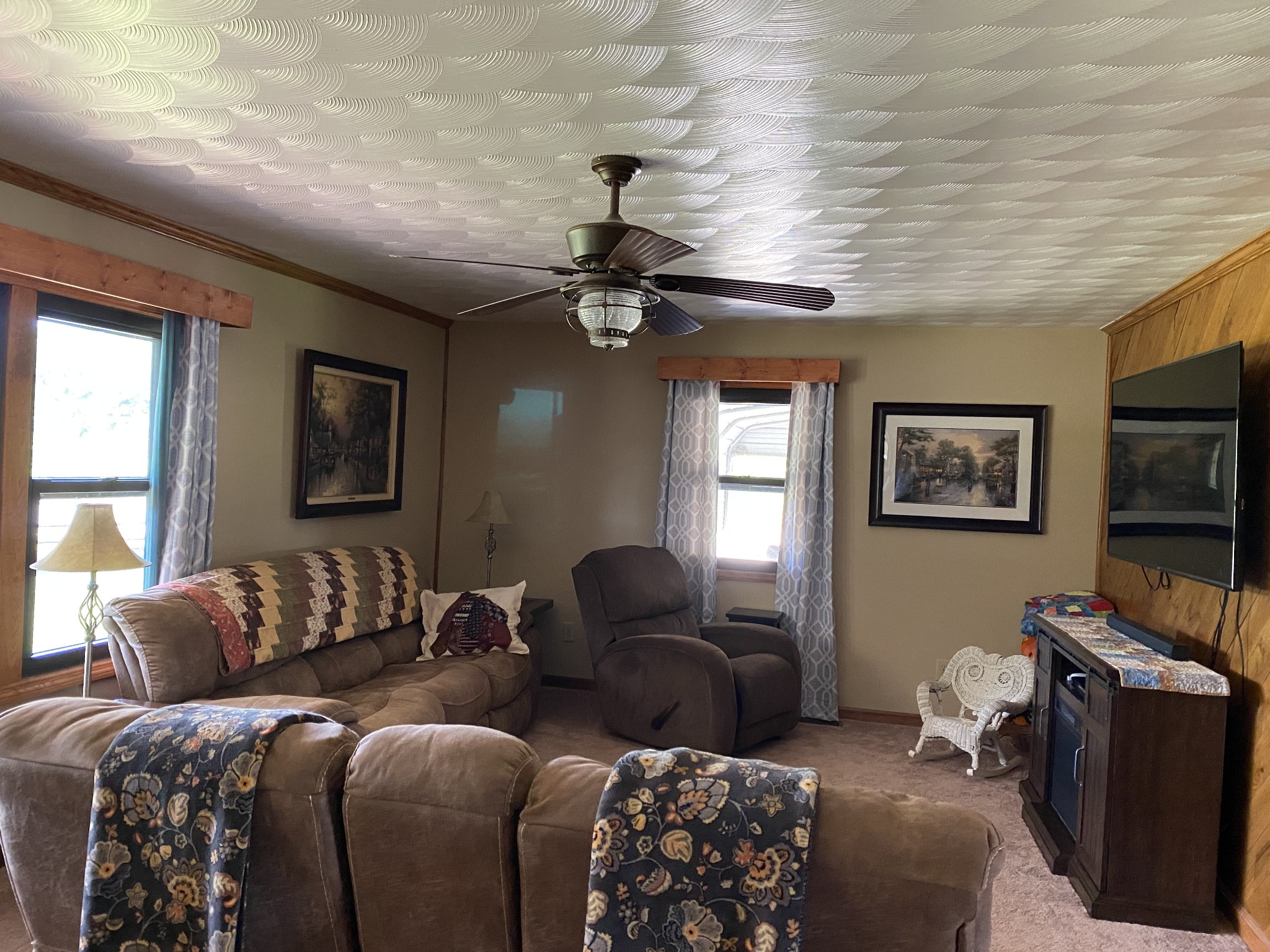 1971 Greenbriar Road Waverly, TN 37185 - Photo 20 of 39 a living room with furniture a large window and a flat screen tv