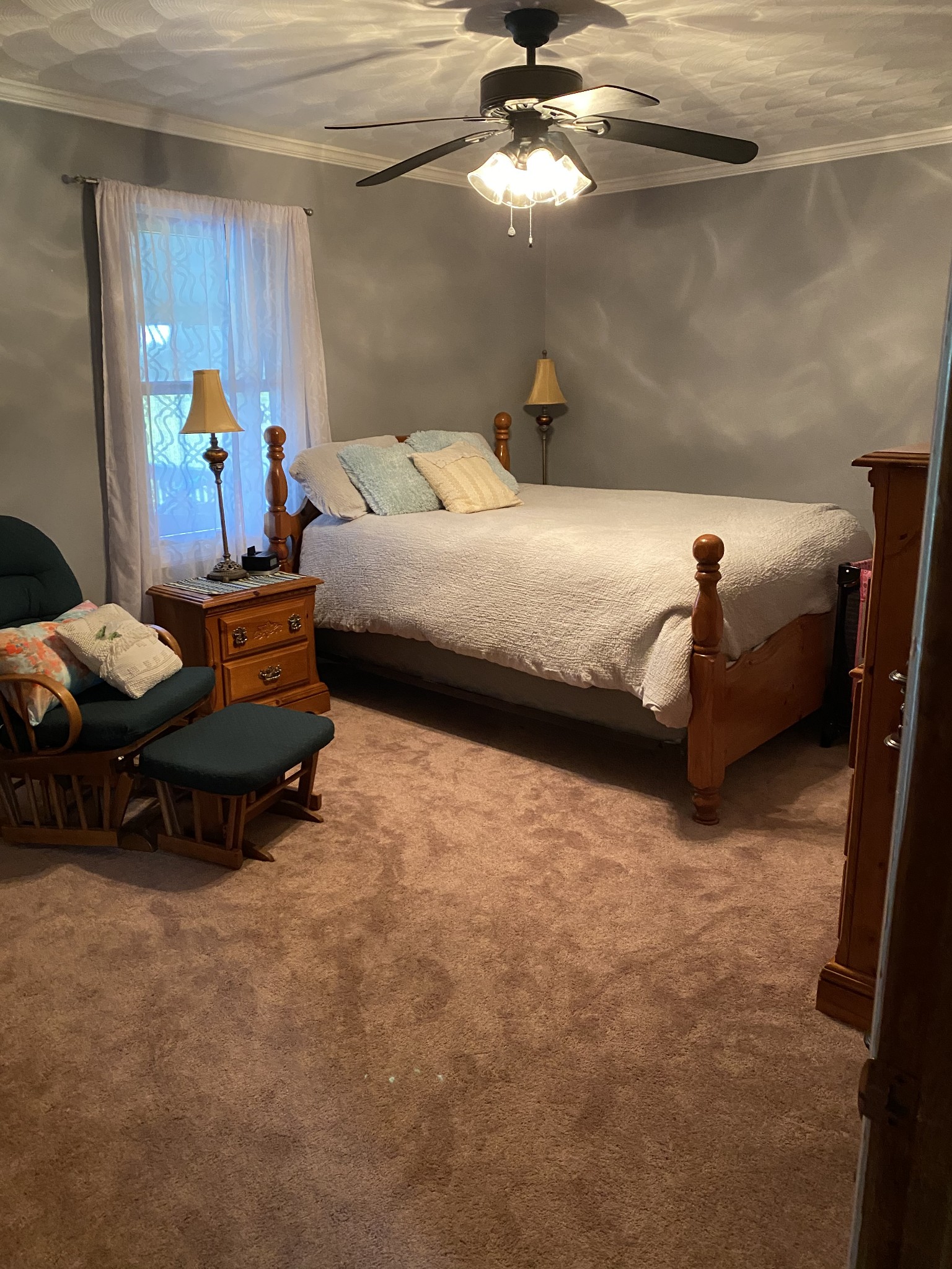 1971 Greenbriar Road Waverly, TN 37185 - Photo 24 of 39 a bedroom with a bed and a chandelier