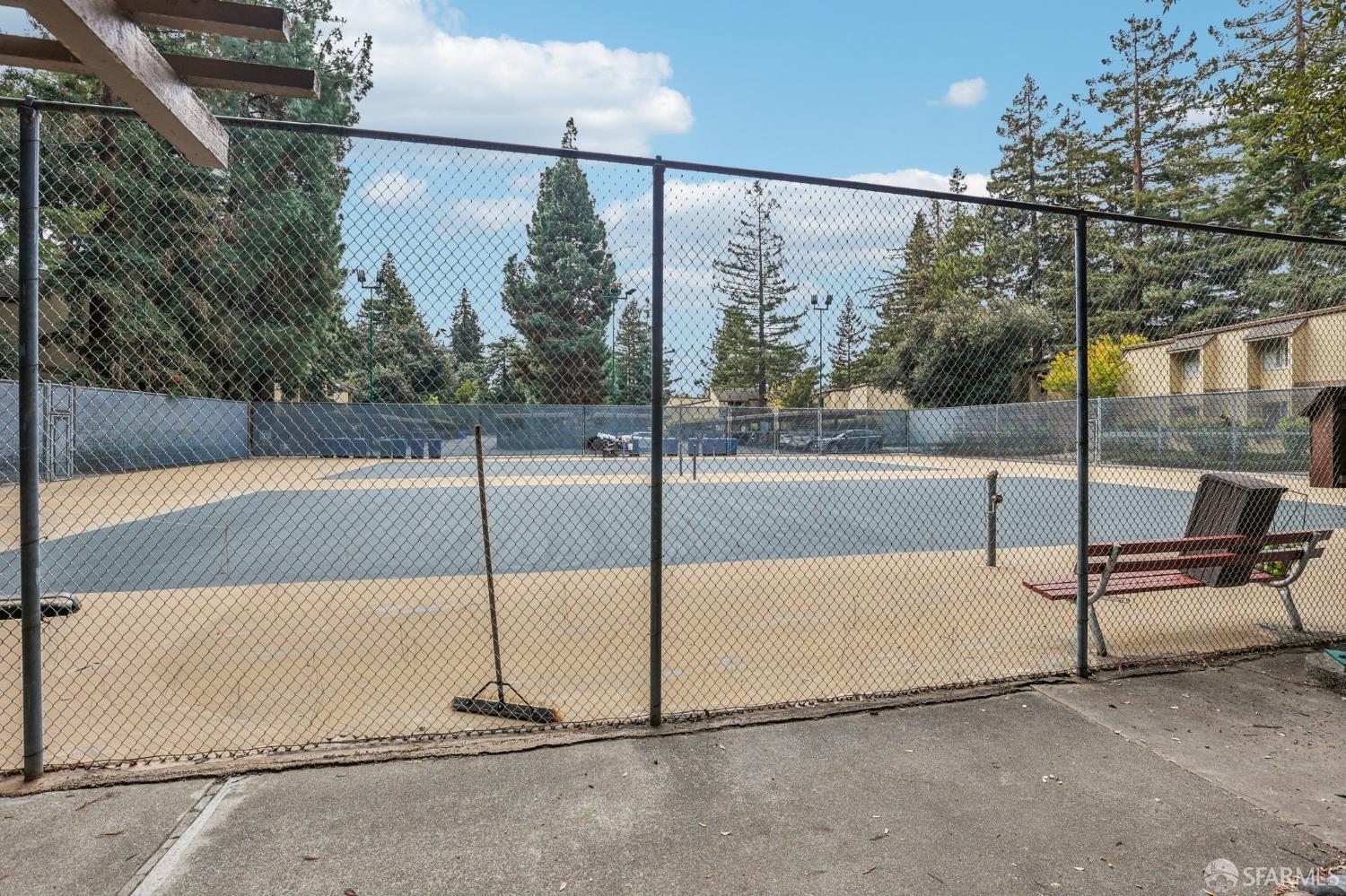 505 Cypress Point Drive, Unit 40 Mountain View, CA 94043 - Photo 24 of 34 a floor to ceiling window with wooden fence