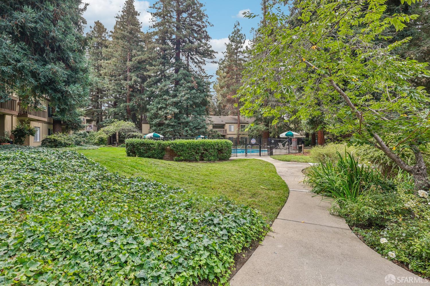 505 Cypress Point Drive, Unit 40 Mountain View, CA 94043 - Photo 25 of 34 a view of a garden with a fountain