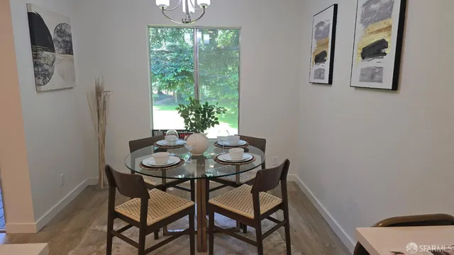 a dining room with furniture and window