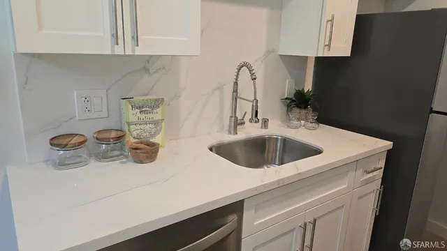 a kitchen with a sink and a stove