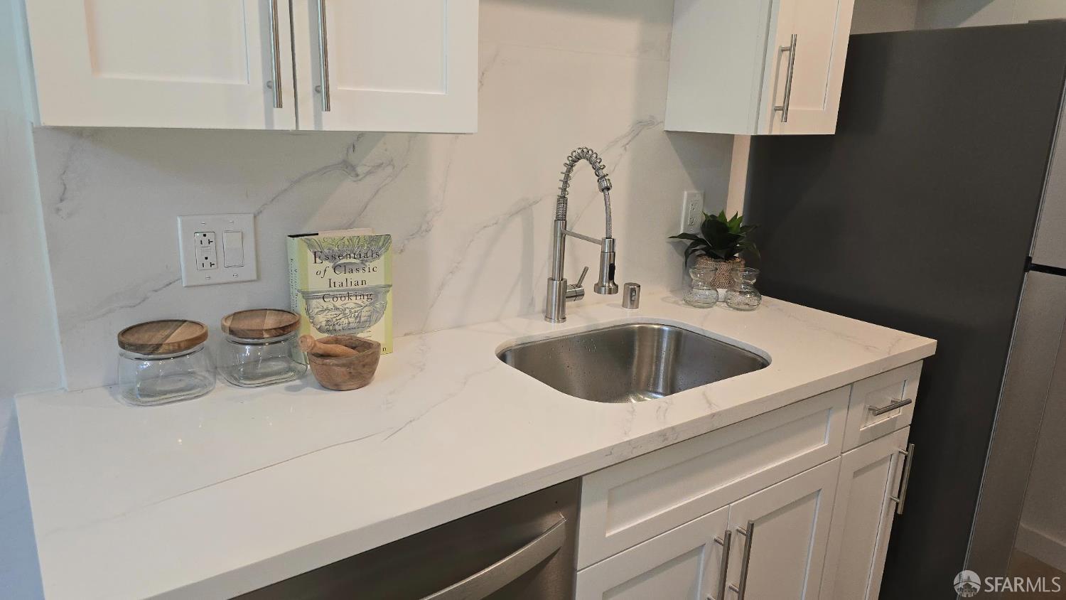 505 Cypress Point Drive, Unit 40 Mountain View, CA 94043 - Photo 34 of 34 a kitchen with a sink and a stove