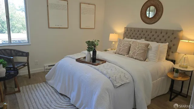 a bedroom with a bed and a table in it