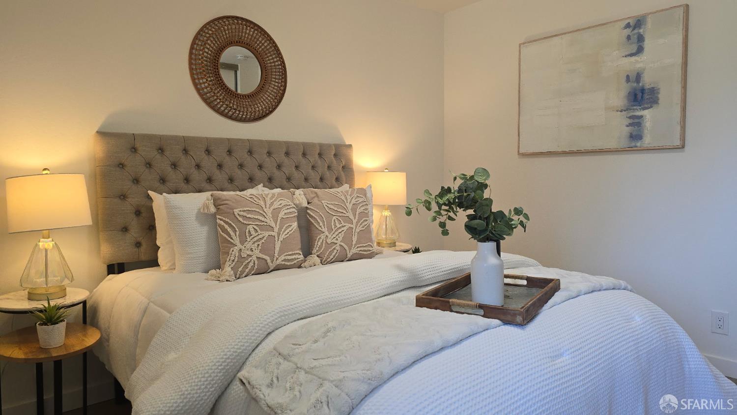 505 Cypress Point Drive, Unit 40 Mountain View, CA 94043 - Photo 6 of 34 a bedroom with a bed and a lamp on dresser