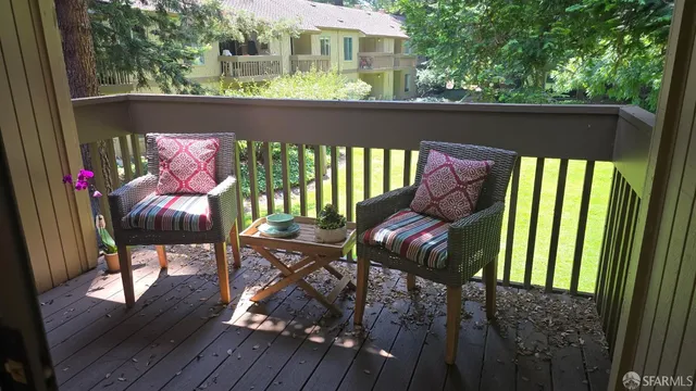 a view of balcony with furniture