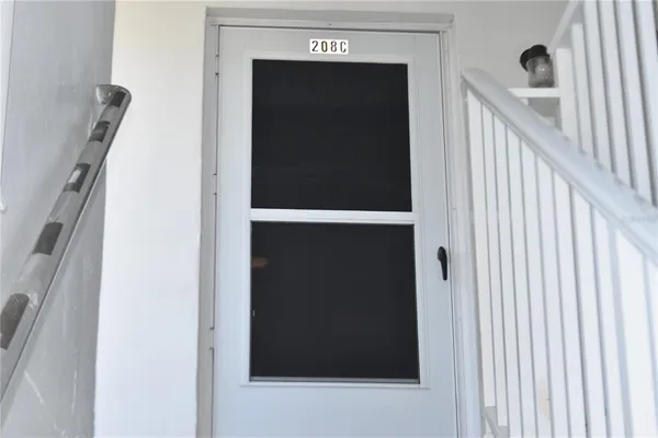a view of hallway with wooden floor