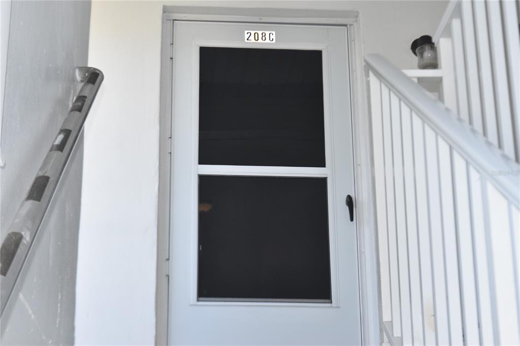 a view of hallway with wooden floor